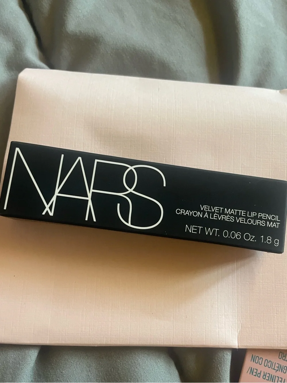 NARS Velvet Matte Lip Pencil in Black Packaging with Pale Pink Accents